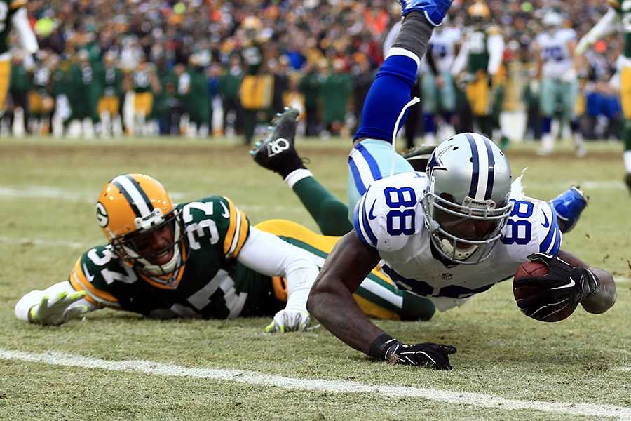 Dallas Cowboys wide receiver Dez Bryant catches the pass and falls just before the endzone. 