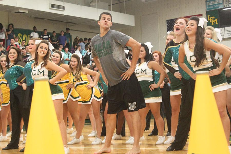 Assistant Principal Ryan DuBose shakes it off with the cheerleaders and Honey Bears at the first pep rally of the year. 