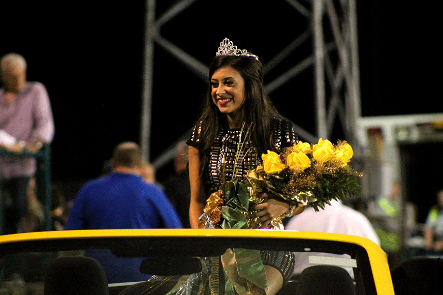 Senior+Sophie+Braud+takes+a+ride+around+the+stadium+after+being+crowned+Homecoming+queen.+