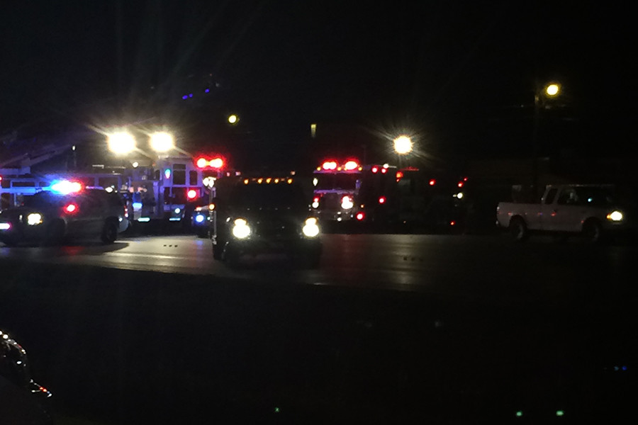 Police and emergency response vehicles begin their investigation on the scene last night.