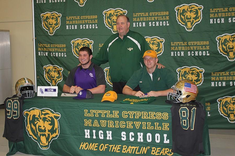 Stuart Viator and Mitchell Lee sign to play collegiate football. 