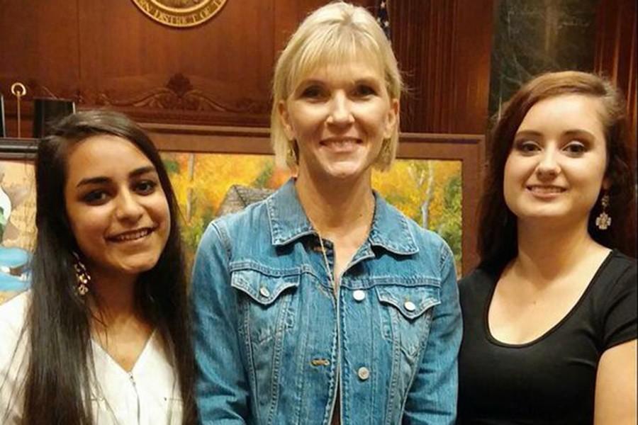 Seniors Sundas Imtiaz and Brooke Tant were honored at the Law Day Art Awards. They are pictured with art teacher Betsy Kaufman. 