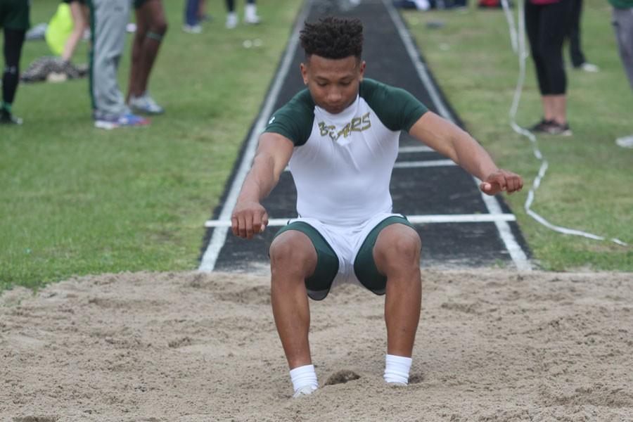 Junior Trey Guillory goes far in the long jump. 