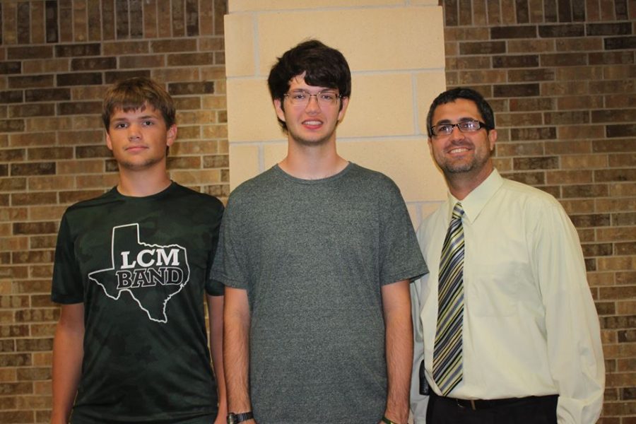 Matthew Cox and Thomas King received news of their award from principal Todd Loupe. 