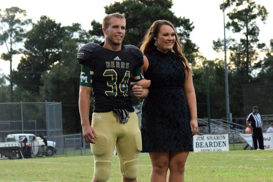 Seniors Kayne Williams and Theresa Beckett are announced on the Homecoming Court. 