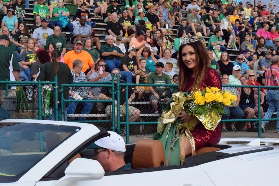 Senior Makennah Moreland waves to the crowd after being crowned Homecoming Queen. 