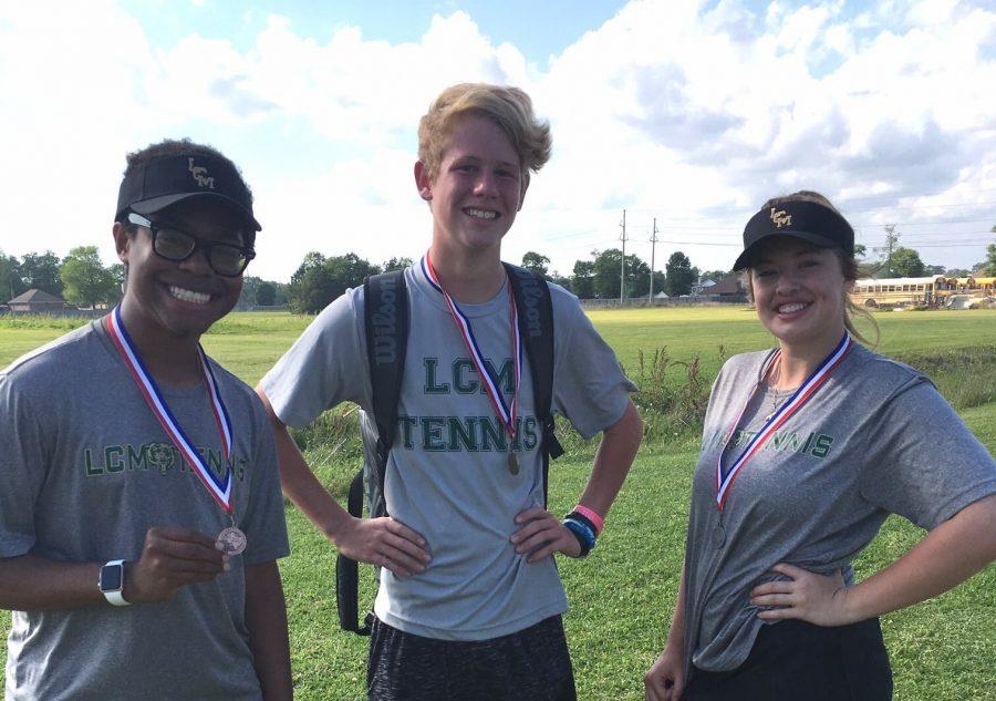 Dylan Chambers, Gavin Fountain, and Grace Walters receive medals at district.