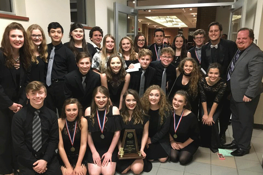 One Act Play team poses with their award after district competition. 