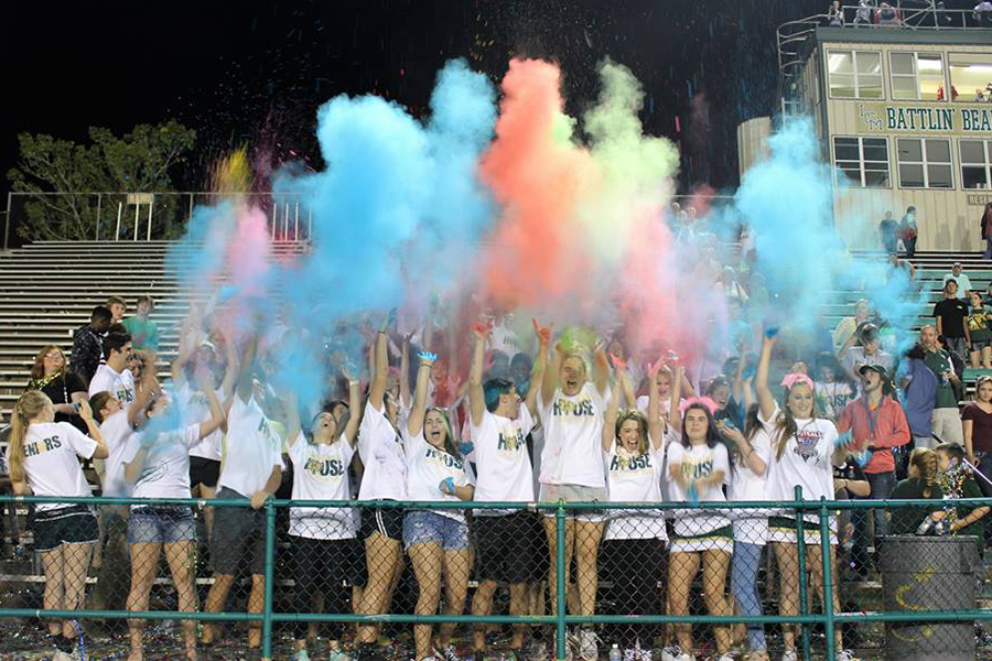 The+student+section+throws+their+confetti+bombs+on+Senior+Night.+