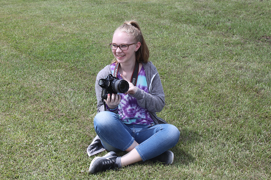 Sophomore yearbook photographer Darian Simmons takes a break from capturing student portraits. 