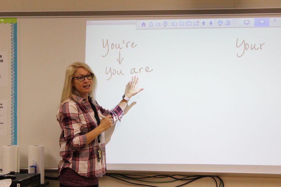 Holly Kelley teaches a grammar lesson to one of her English classes. 