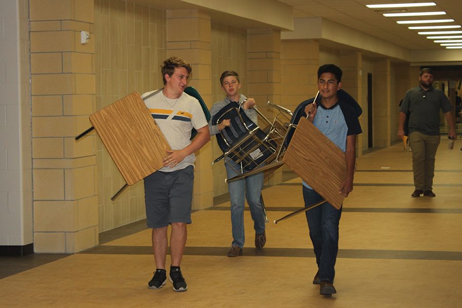 Students help teachers move into their new classrooms last year. 