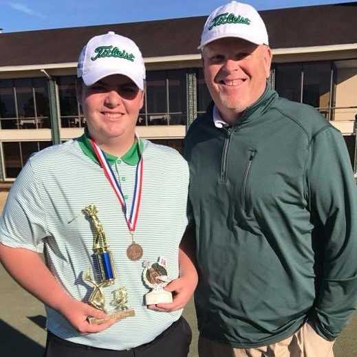 Freshman Jack Burke poses with his father after winning a recent tournament.
