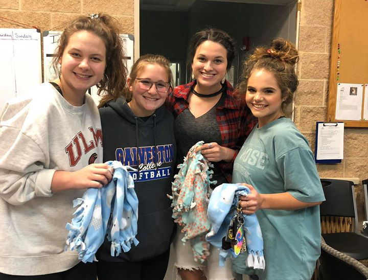 Members of Interact recently made blankets for local dog shelters. 