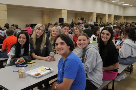 A group of seniors enjoys lunch, as their final year of high school begins. 