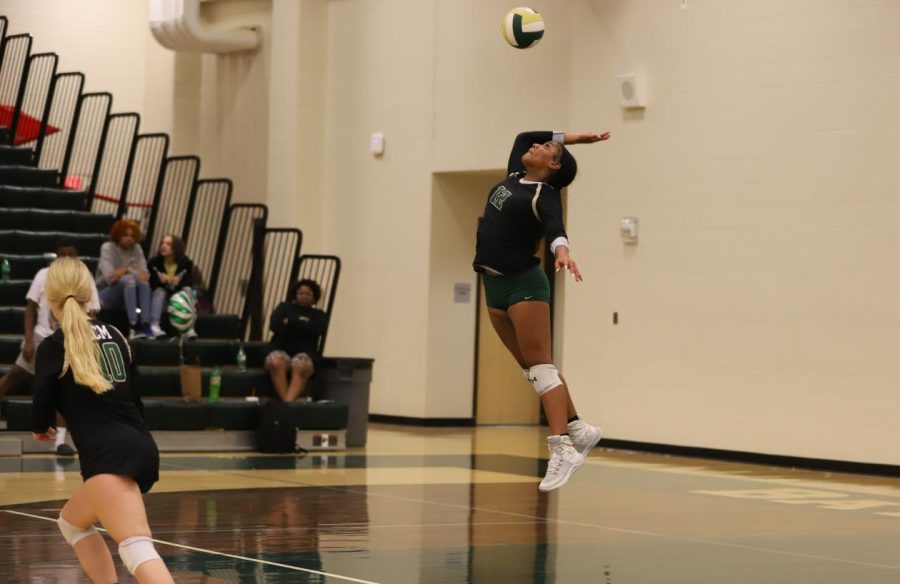 Senior Chrissy Joseph makes a hard serve for the Lady Bears in a district game against Lumberton. 