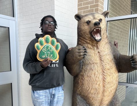 Senior Jabron Smith opens the door for students every morning. 