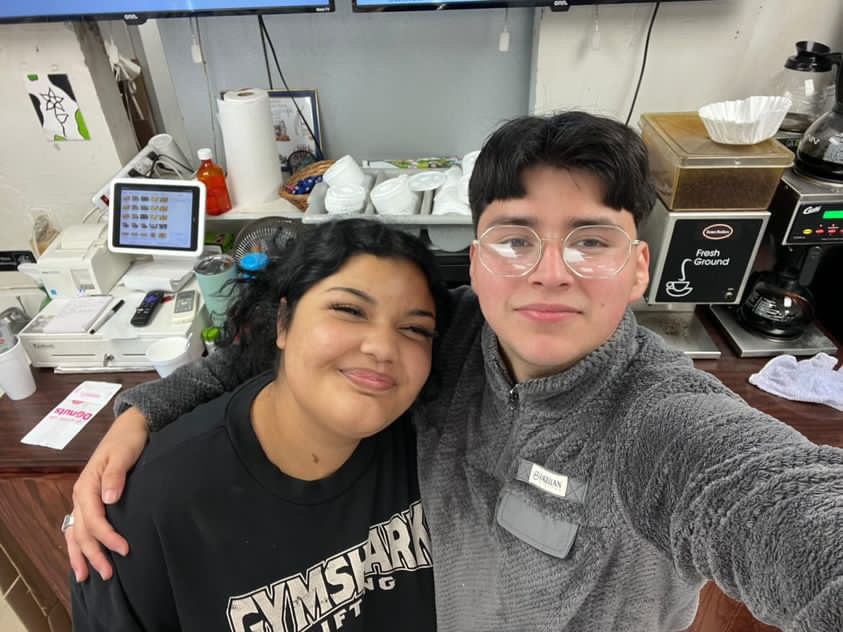 Senior+Kailey+Arnold+gets+up+and+goes+to+work+at+the+Donut+Palace+every+morning+before+school.+She+is+pictured+here+with+her+co-worker.+