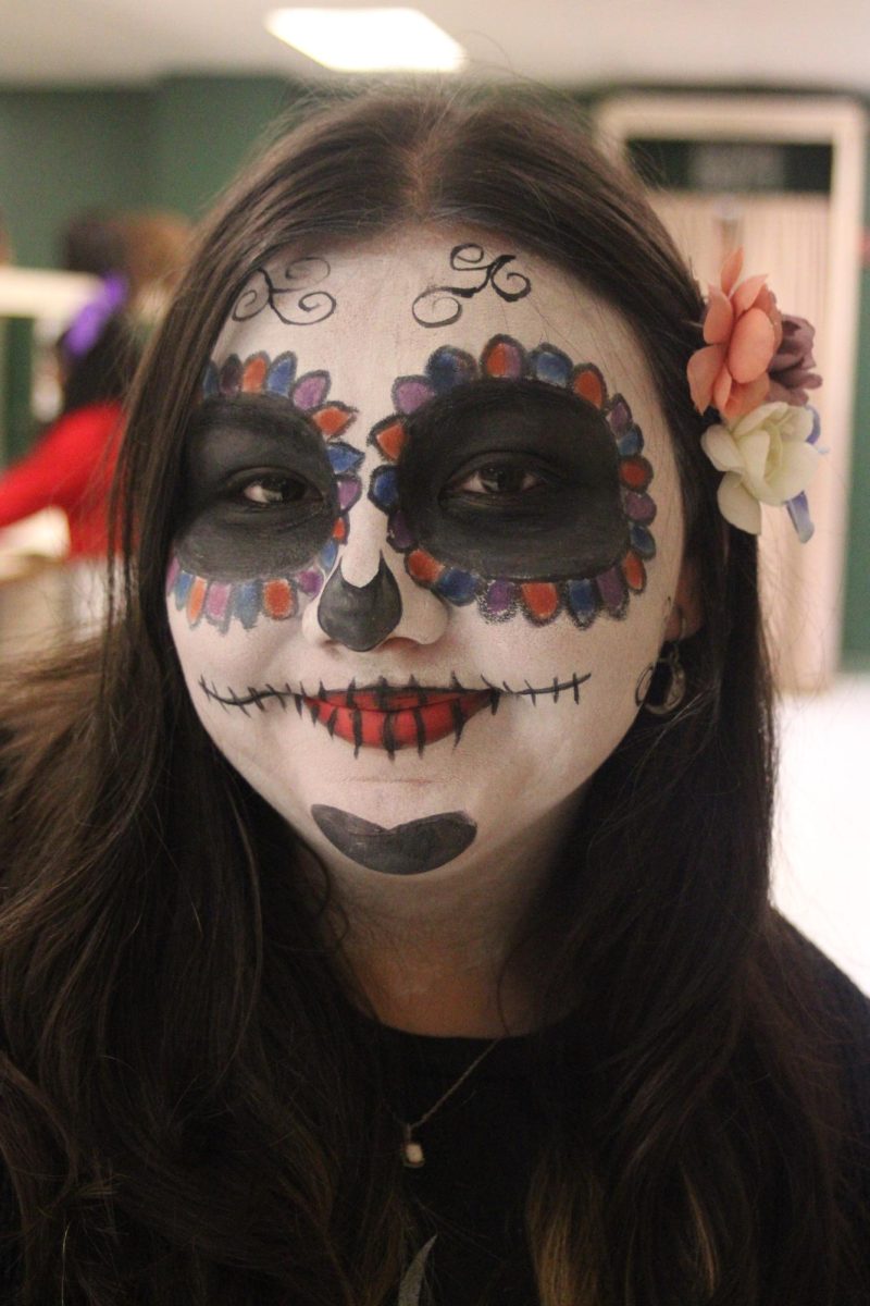 Junior Elena Salinas shows off her makeup skills that she learned in cosmetology. 