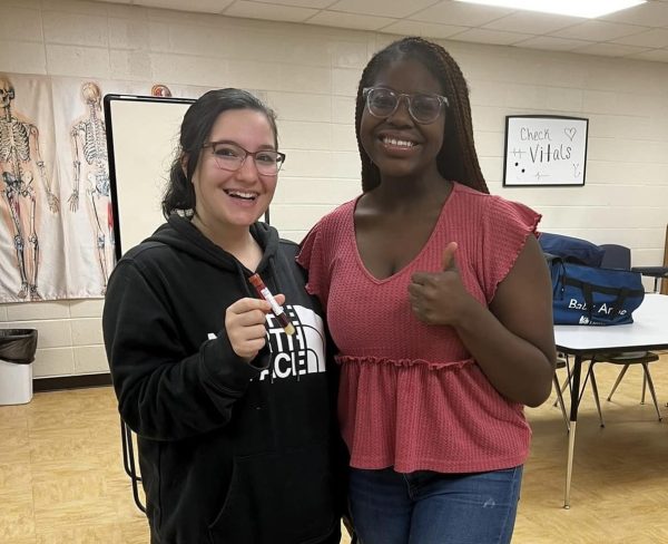 Seniors Elyse Martin and Sethnika Hancock recently became certified clinical medical assistants. 