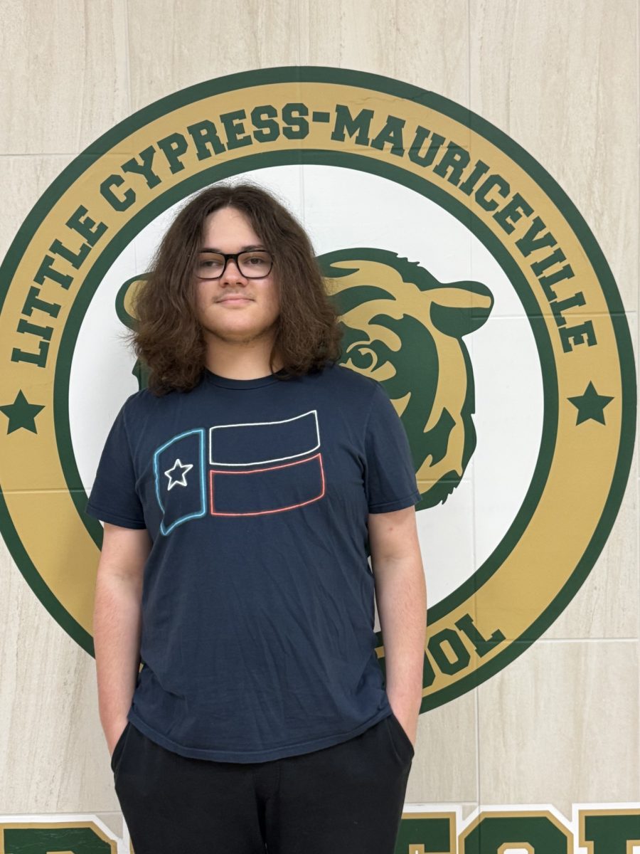 Junior Louis McClelland standing for the staff picture for the LCM Bear Facts 2025-2026 Staff