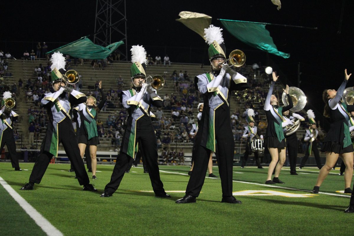 The band performs at halftime during the Homecoming football game. 