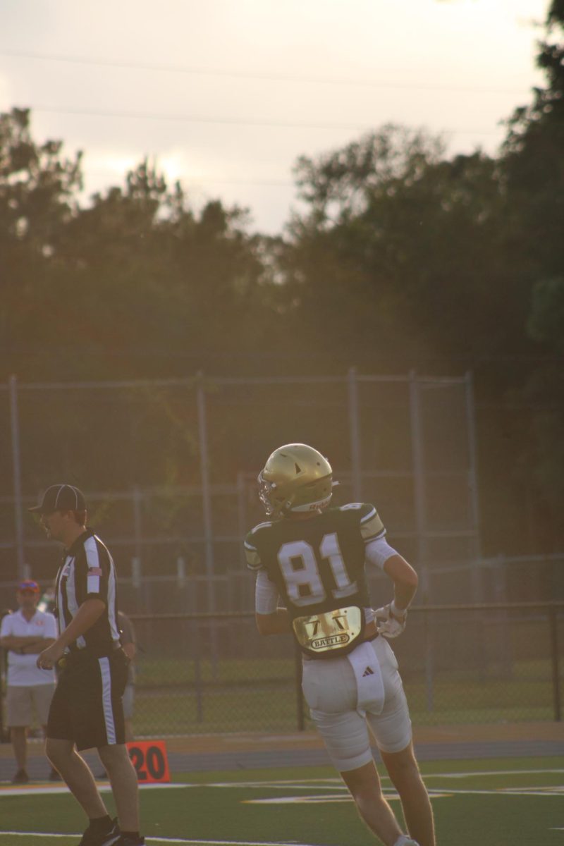 Number 81 jogs off a play