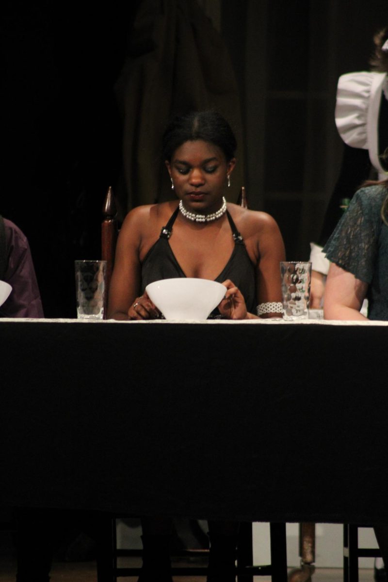 Senior Canyon Gaulden performs as Mrs. White in the school production of CLUE.
