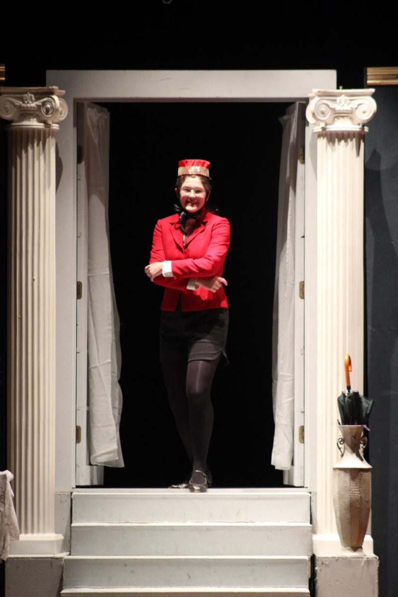 Junior Victoria Sulak performs as the "Singing Telegram Girl" in the performance of "Clue."