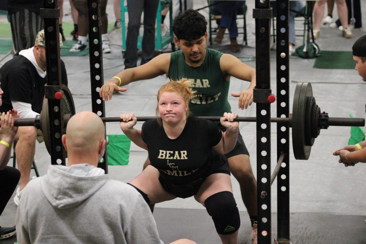 Senior Karlee Cooksey attempts a second squat at the LCM meet on Feb. 5.